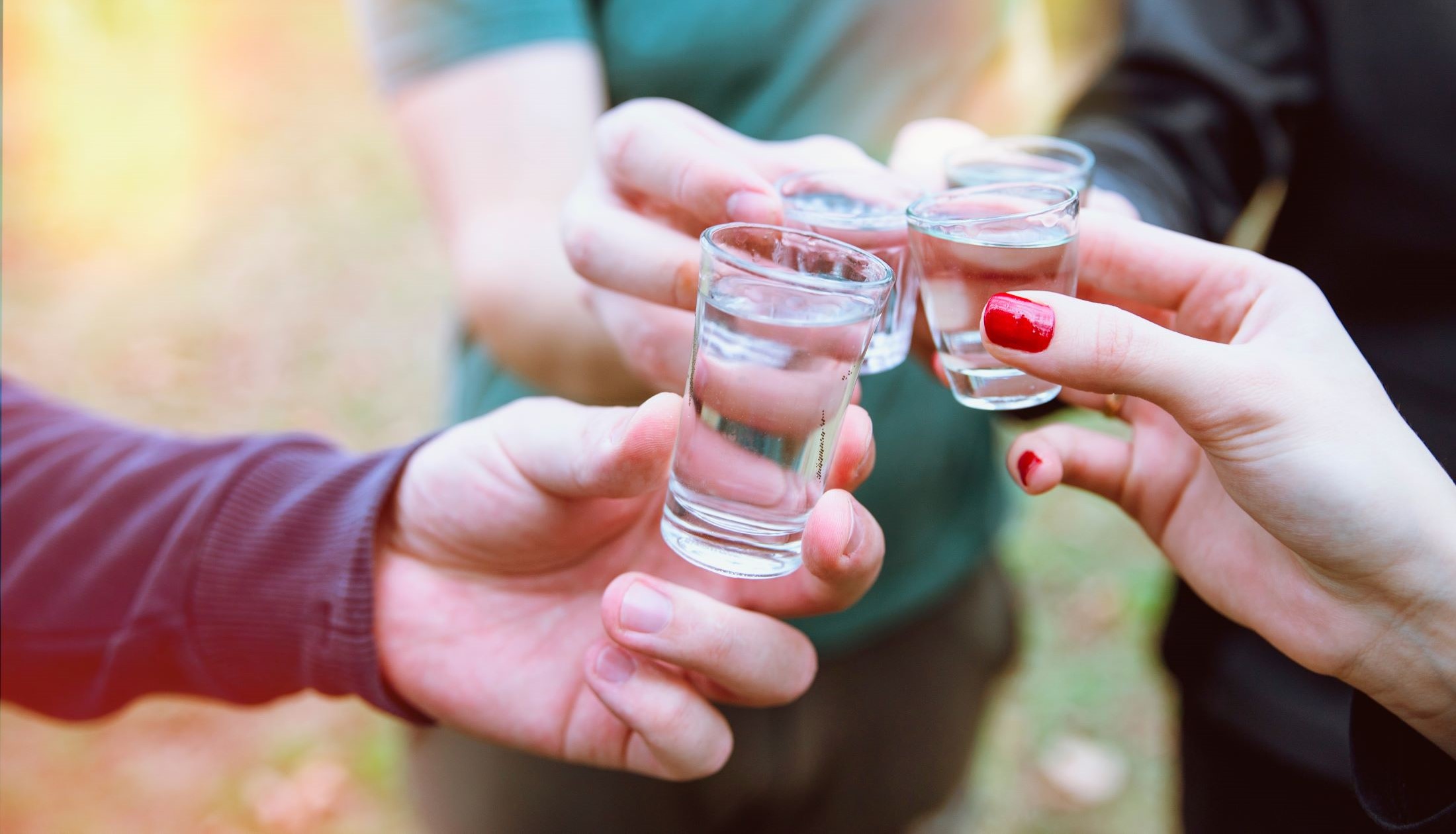 Raki is a clear grape spirit produced by farmers, wineries, distilleries and families throughout Crete people drinking raki