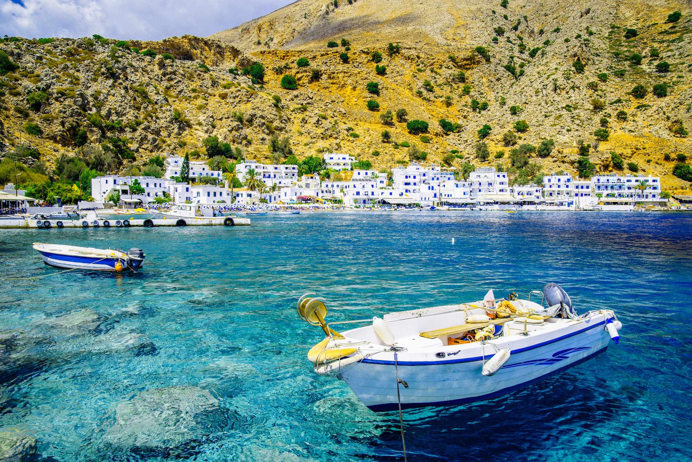 Virgin naturalistic scenery in South Crete boat in blue crystal waters