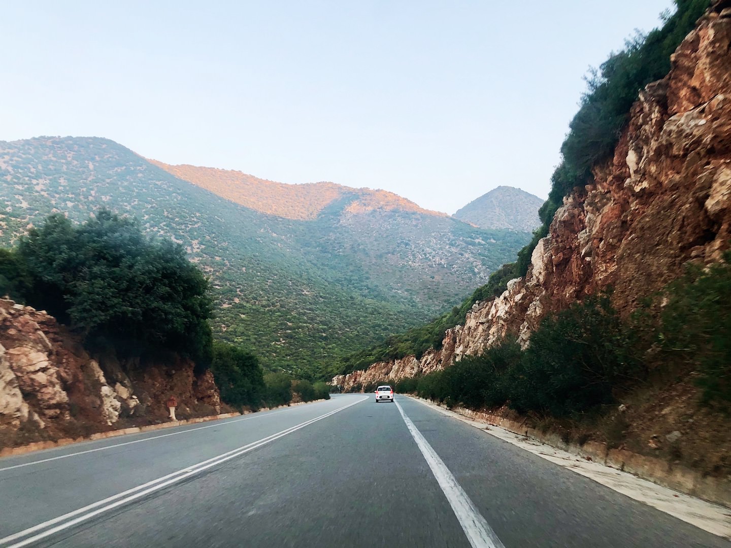 A selection of some of the best road trips one can do in Crete country road with mountainous background
